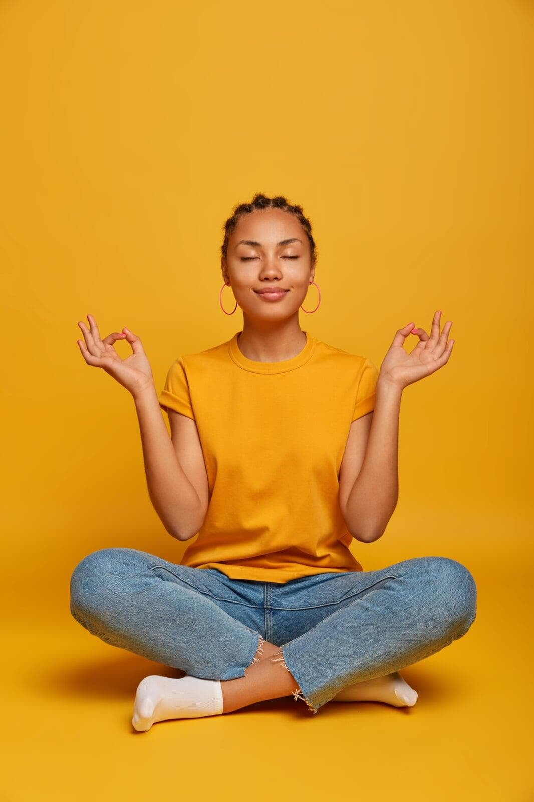 Silhouette of a woman doing a calm yoga stretch